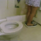 A girl stands on a scale to weigh herself, takes a shit on the toilet, and weighs herself again. Too bad we cannot see the result of the weight loss. About 3 minutes.